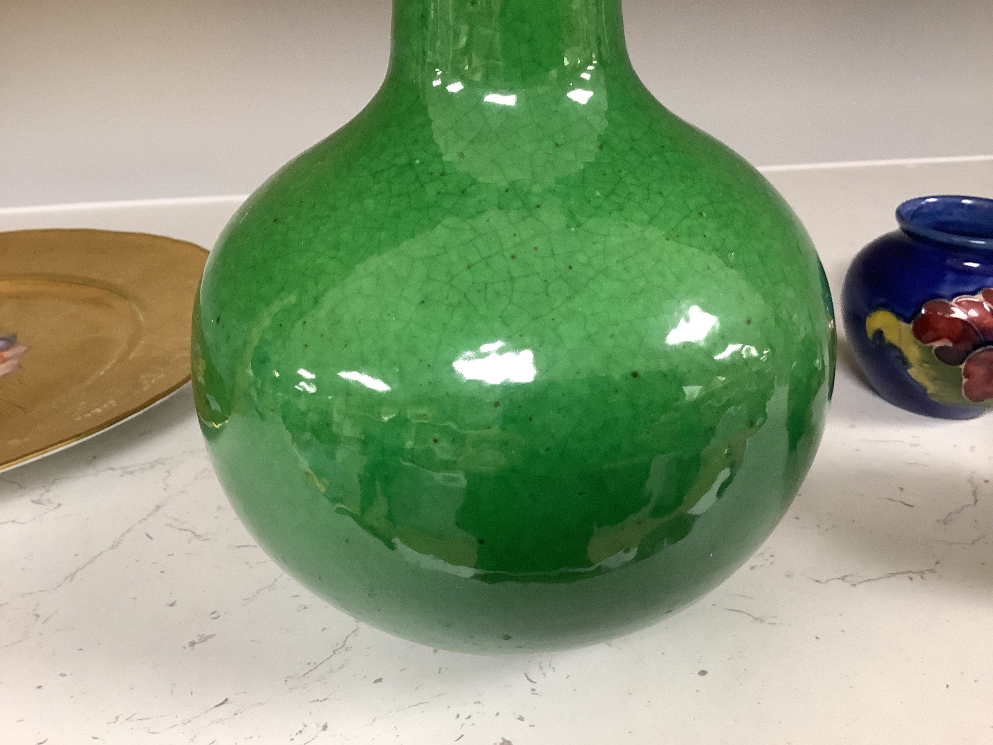 A Chinese green crackle glaze monochrome bottle vase, 24 cm high